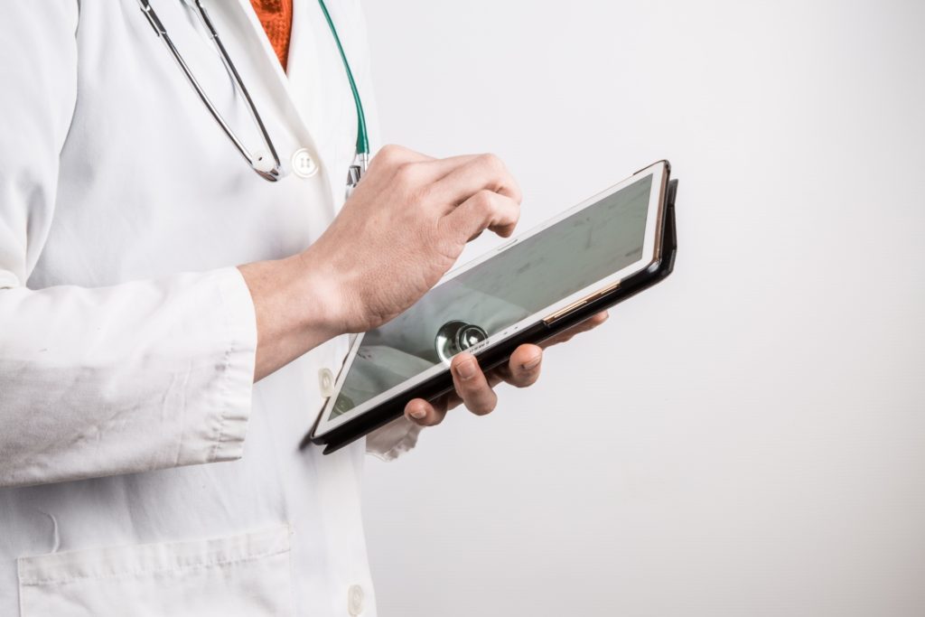doctor-with-tablet-1461913224a9i